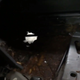 One of the passenger-side floorboard holes.
